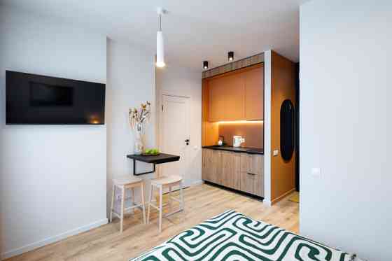 A modern and meticulously designed studio apartment is available for reservation at Ernesta Birzniek Рига