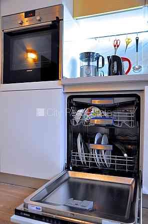 Дом во дворе, реновированный дом, фасад отделанный декоративным кирпечём, Рига