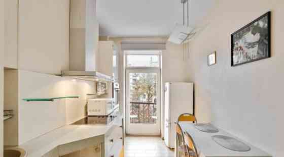 A two-room apartment with separate rooms, a balcony, and a parking space.  The apartment is fully fu Rīga