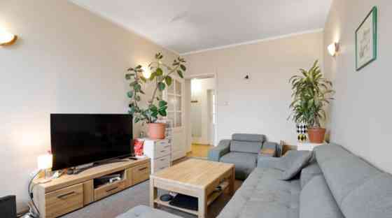 A two-room apartment with separate rooms, a balcony, and a parking space.  The apartment is fully fu Rīga