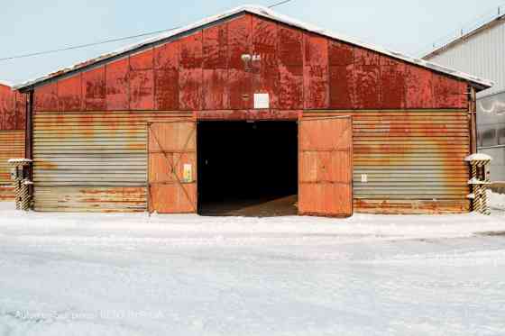 Warehouse No. 20 in the industrial area at 24 Braslas Street.  A metal hangar with one large space m Rīga