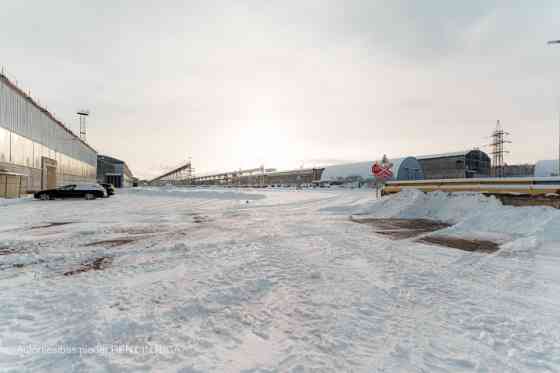 Warehouse No. 20 in the industrial area at 24 Braslas Street.  A metal hangar with one large space m Rīga