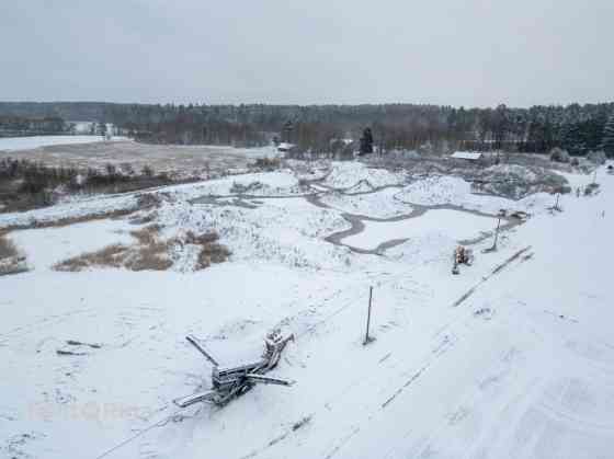 Продаётся инвестиционный объект  земельный участок с действующим карьером и Бауска и Бауский край