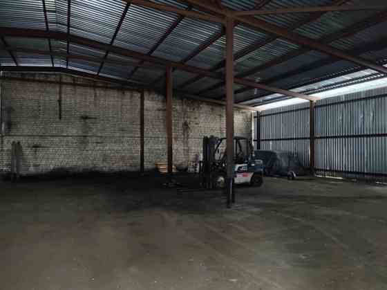 Metal hangar with columns.  Level concrete floor. Inside the hangar there is a 37 sq.m brick buildin Рижский район