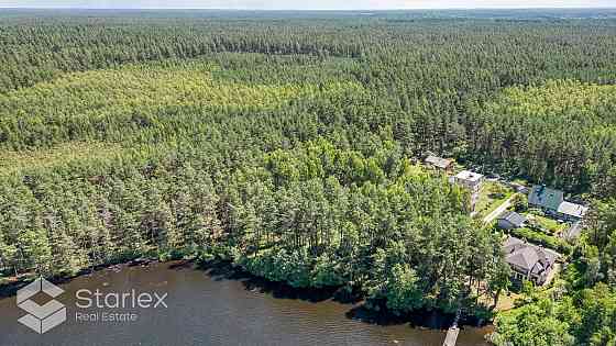 В живописном месте на берегу самого озера Лангстини продается уникальный Рижский район
