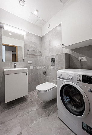 Новостройка, благоустроенный озеленённый двор, гараж на одну машину, лифт, Рига - изображение 17