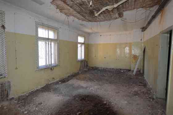 Premises located on the ground floor of a wooden residential building.  Total area of the premises:  Рига