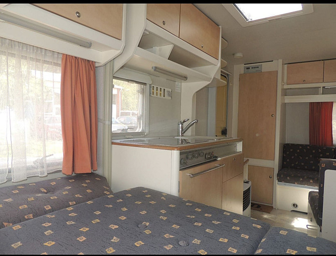 Прекрасный и очень ухоженный прицеп KIP 440 Grey-Line с двумя зонами отдыха, тентом, 3-точечным... Рига - изображение 4