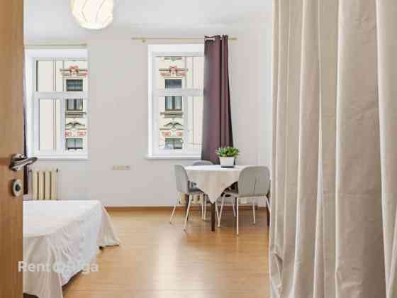 Quiet, bright, and sunny apartment on Stabu Street.  The apartment features four rooms (1724 m), thr Rīga