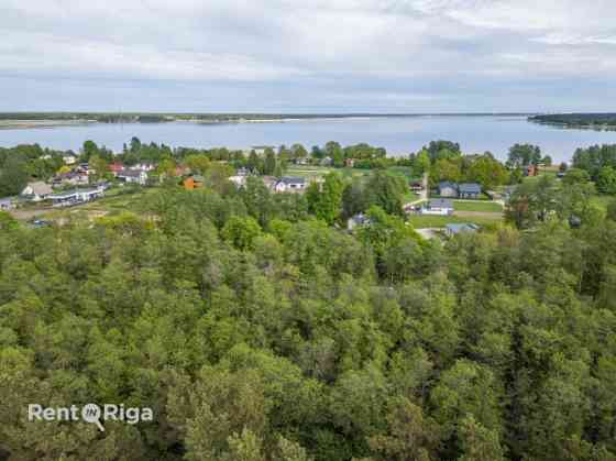 Land plot between Jaunciema gatve and the forest.  The property is located along Jaunciema gatve, be Rīga