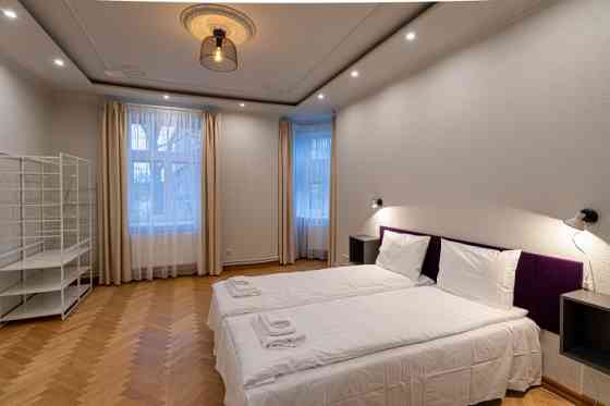 Renovated office building with a large parking lot that can be used for various types of business.   Rīga
