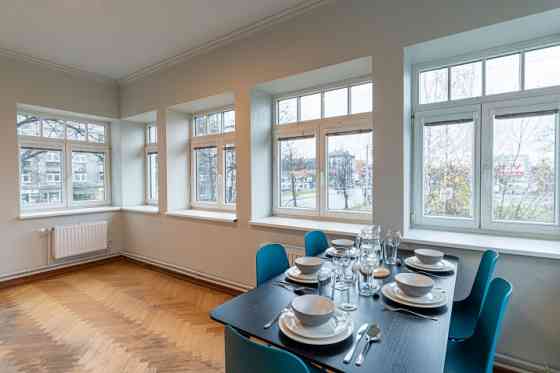 Renovated office building with a large parking lot that can be used for various types of business.   Rīga