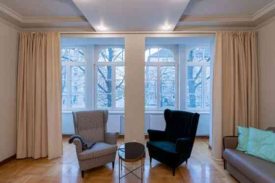 Renovated office building with a large parking lot that can be used for various types of business.   Rīga