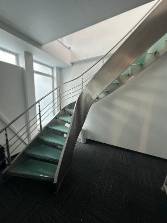 Modern open-plan office on the 6th and 7th floors of the building  The office is spread over two lev Рига - изображение 16