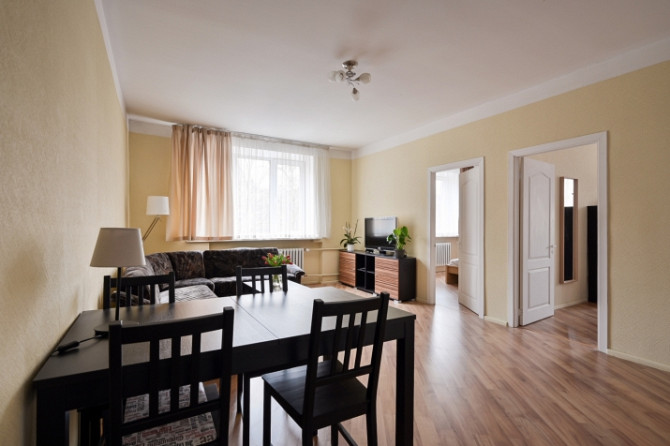 A furnished two-bedroom apartment in the very center of the city, which at the same time allows you  Рига - изображение 11